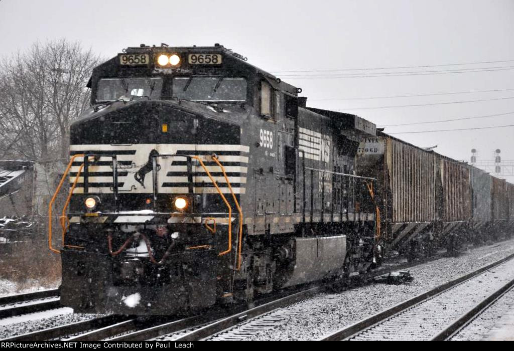 Grain train rolls east in the snow